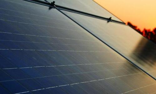 close up of solar panels at sunset