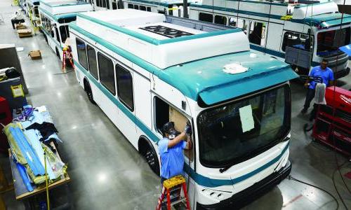 Workers construct electric buses